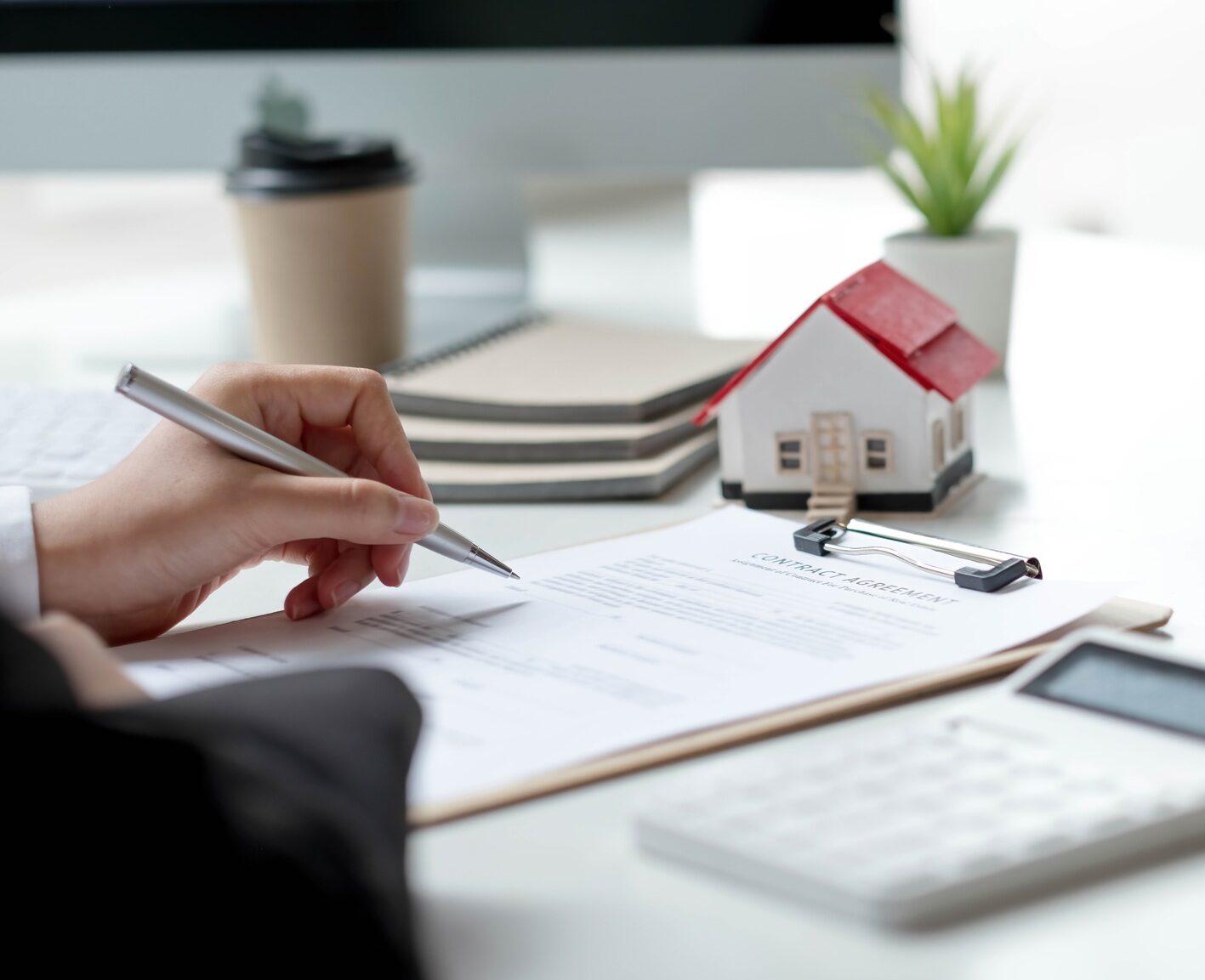 Real estate brokers sign contract paper. Real estate agent, property broker, real estate investment